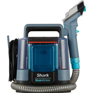Shark StainStriker portable carpet cleaner in Nordic blue and grey with transparent water tanks, coiled hose, and spray trigger attachment on white background