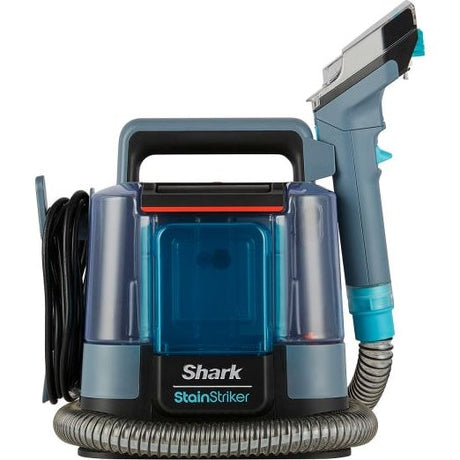 Shark StainStriker portable carpet cleaner in Nordic blue and grey with transparent water tanks, coiled hose, and spray trigger attachment on white background