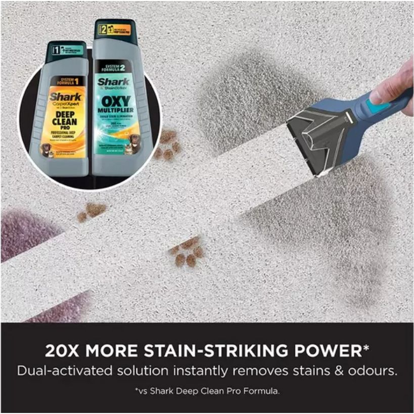 Shark Portable StainStriker carpet cleaner in Nordic blue with dual cleaning solution bottles showing 20x more stain-striking power compared to Deep Clean Pro, demonstrated removing brown stains from light grey carpet