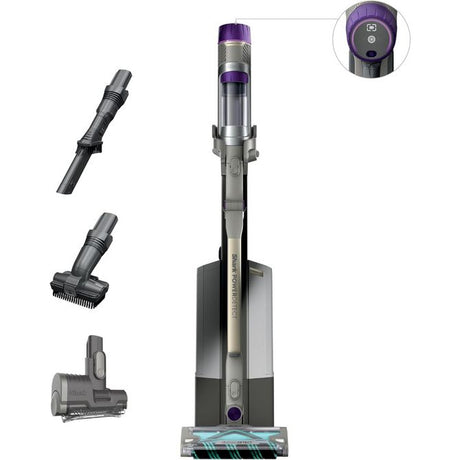 Shark PowerDetect cordless pet vacuum cleaner with purple and grey design, showing main unit with dust cup, motorhead brush, crevice tool, and pet hair attachment, plus handheld controls displayed on white background