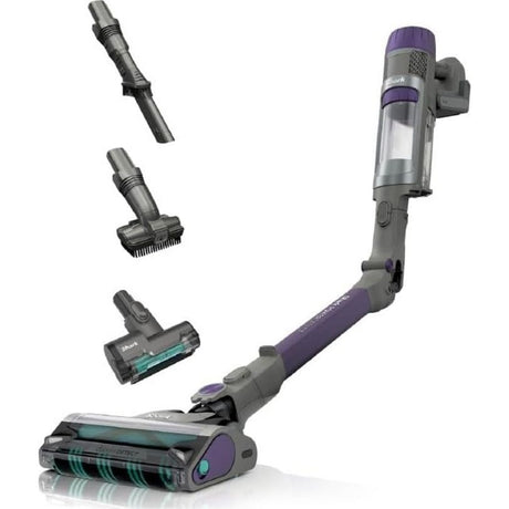 Shark PowerDetect cordless stick vacuum cleaner in purple and grey with detachable handheld unit, featuring motorized pet brush head, crevice tool, and multi-surface cleaning attachments displayed on white background