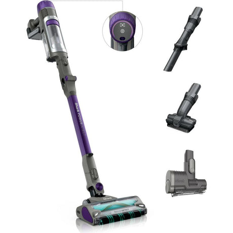 Shark PowerDetect cordless stick vacuum cleaner in purple and grey with pet hair attachment, showing main unit, digital display, crevice tool, brush head, and motorized pet tool against white background