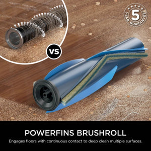 Comparison diagram of Shark PowerPro vacuum brushroll technology showing traditional spiral brush versus blue PowerFins brushroll design engaging carpet and hard floors with 5 year guarantee badge