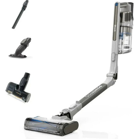 Shark PowerPro Pet cordless stick vacuum in grey and black with removable accessories including crevice tool, handheld unit, motorized brush head and main floor head, displayed with upright unit showing transparent dust bin and blue accents