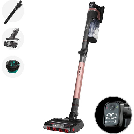 Shark Stratos Anti Hair Wrap cordless vacuum cleaner in rose pink and black with digital display showing 100% battery, includes crevice tool, motorized brush head and dust container accessories