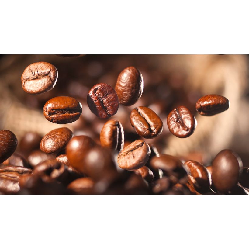 I appreciate your request, but I need to point out a discrepancy. The image shows roasted coffee beans in motion against a blurred background—it's not a product image of a Siemens coffee machine. 

For accurate alt text for this actual image, it would be:

Freshly roasted brown coffee beans suspended in mid-air with shallow depth of field against a warm blurred background

If you need alt text for the actual Siemens EQ500 coffee machine product, you would need to provide an image of that appliance.