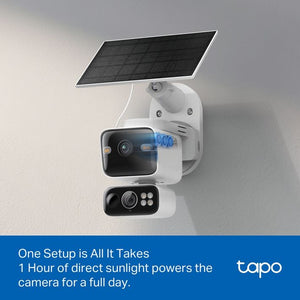 TP-Link Tapo solar-powered dual lens security camera mounted on white wall with black camera lenses and blue indicator lights, featuring integrated solar panel on adjustable white bracket against grey wall