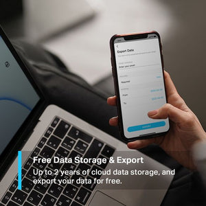 Hand holding smartphone displaying Export Data screen with email input fields and date range selection, positioned above laptop keyboard, with text overlay describing free cloud data storage and export features for TP-Link Tapo smart sensor