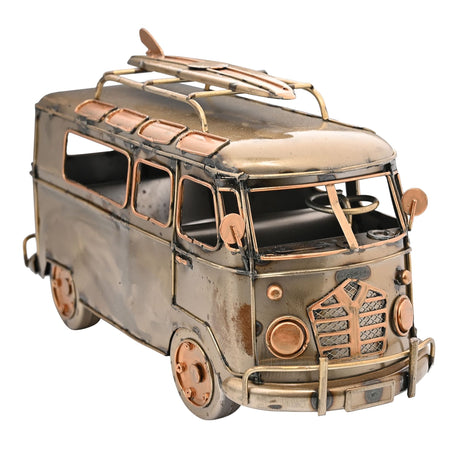 Metallic model of a van with a surfboard on top, on a white background
