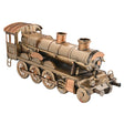 Bronze-colored model of a steam locomotive on a white background