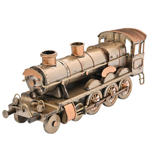 Vintage-style steam locomotive ornament made of brushed copper and bronze metal with detailed boiler, smokestack, cabin and wheels against white background