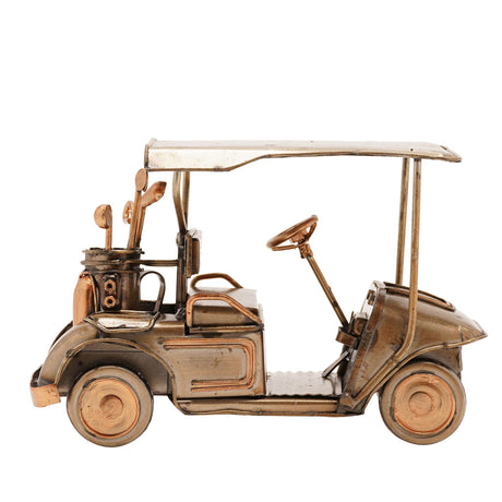 Bronze and copper metal golf buggy ornament with cream canopy top, featuring detailed wheels, steering mechanism, and golf clubs in holder, photographed against white background