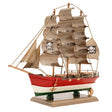 Model pirate ship with red hull, white deck, and brown sails on a white background
