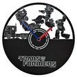 Transformers-themed wall clock with robot figures and Autobot logo.