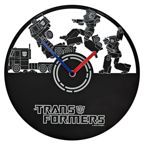 Transformers-themed wall clock with robot figures and Autobot logo.