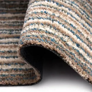 Hug Rug Doormat 80cm x 100cm in sand color with cream and blue striped pattern, showing rolled edge and dark rubber backing