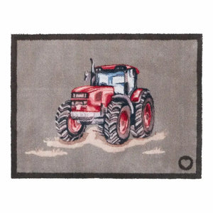 Hug Rug doormat featuring a red farmyard tractor with large black treaded wheels on a grey background, bordered by dark charcoal edging, 65cm x 85cm