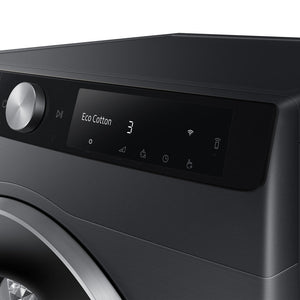 Samsung Series 6 AI Energy 9KG heat pump tumble dryer in black with digital display showing Eco Cotton cycle, metallic control knob, and touch control buttons including WiFi connectivity icon
