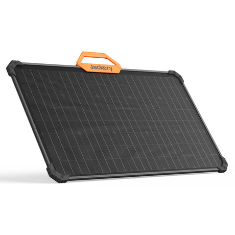 Jackery SolarSaga 80W portable solar panel with black monocrystalline solar cells, orange carrying handle, and dark gray reinforced frame corners shown at an angled perspective against a white background
