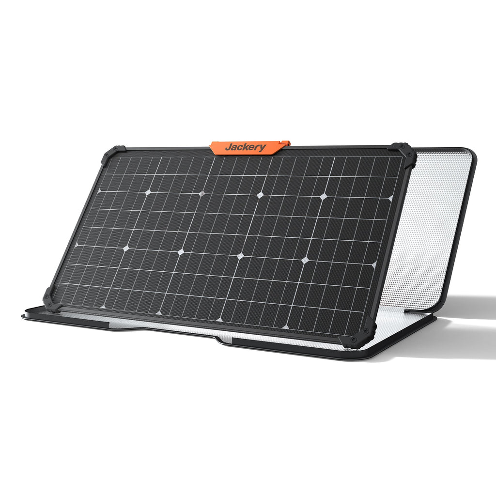 Jackery SolarSaga 80W portable solar panel with black frame and orange branding label, featuring dark solar cells with white connection points and white mesh backing panel, displayed at an angled position