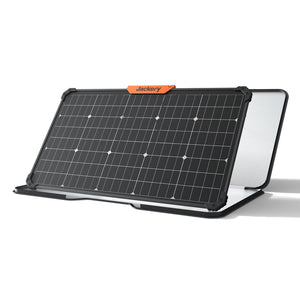 Jackery SolarSaga 80W portable solar panel with black frame and orange branding label, featuring dark solar cells with white connection points and white mesh backing panel, displayed at an angled position