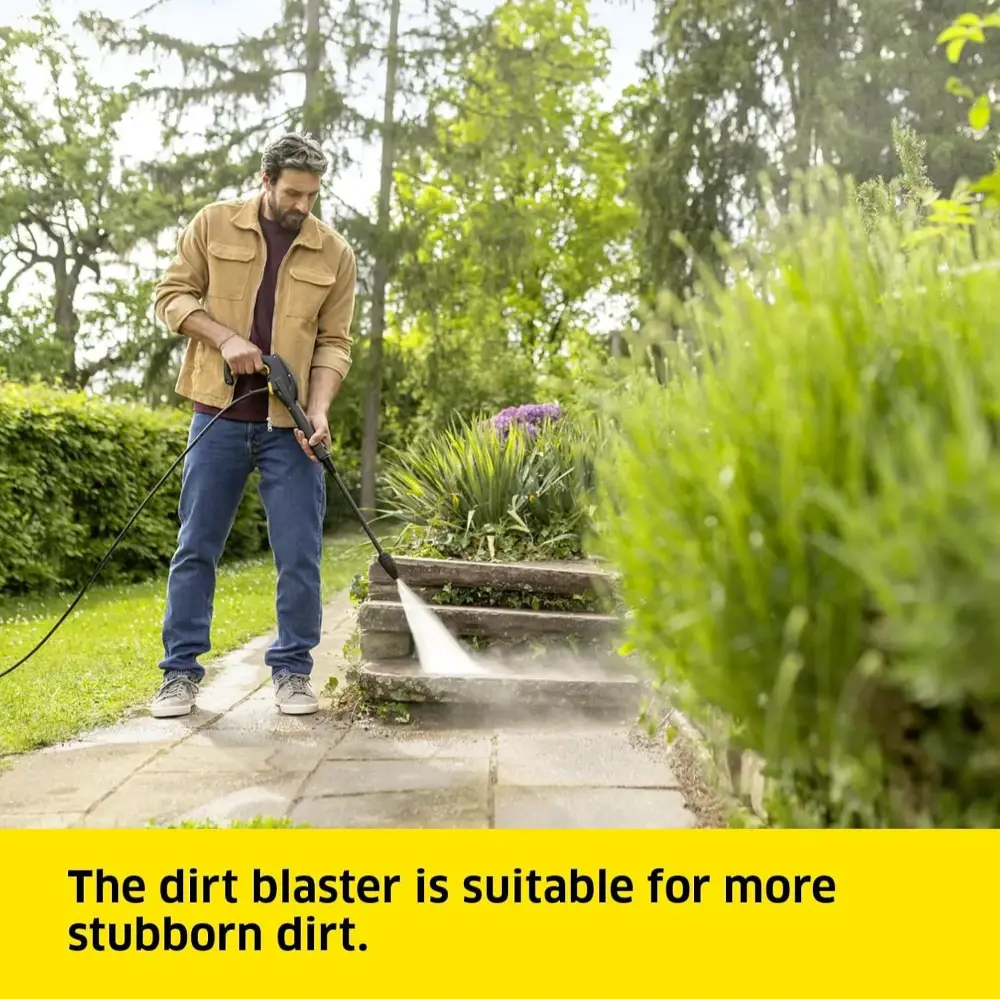Man using a pressure washer on garden steps with text about the dirt blaster's effectiveness.