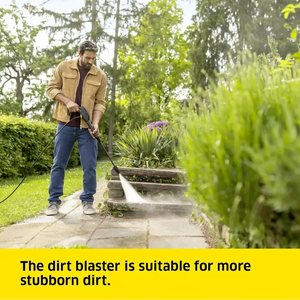 Man using a pressure washer on garden steps with text about the dirt blaster's effectiveness.