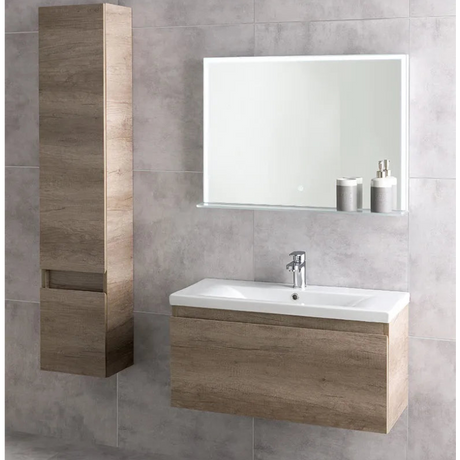 Modern wall-hung bathroom vanity unit in Nebraska Oak with white ceramic sink, chrome tap, illuminated mirror with shelf, and matching tall storage cabinet against grey tile wall