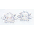 Pair of clear glass lotus-shaped tealight holders with iridescent lustre finish, featuring petal-like segments and central circular wells, displayed against a white background
