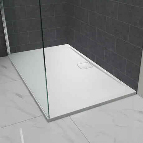 Merlyn Level25 white rectangular shower tray with 25mm height installed in modern bathroom with dark grey tile walls and marble effect flooring, featuring glass shower screen panel