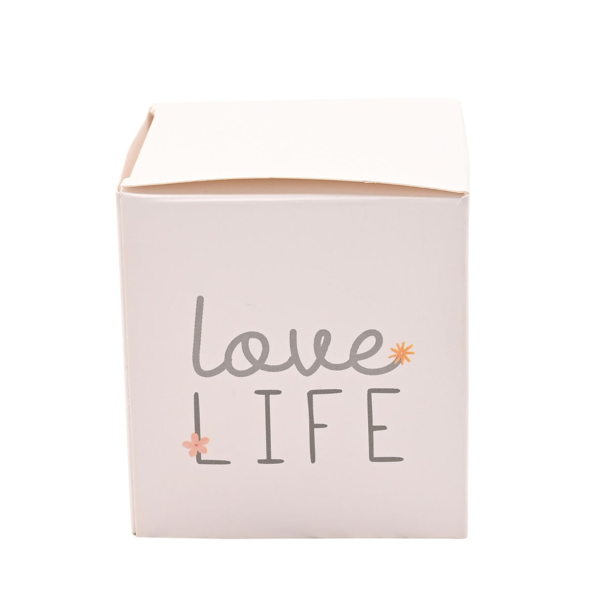 Pale pink cylindrical tin candle with gray and coral text reading "love LIFE" decorated with small floral accents, displayed against a white background