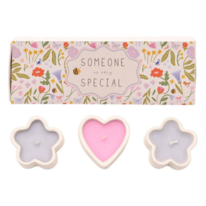 Set of three decorative mini candles with cream-colored ceramic holders in flower and heart shapes, filled with pink and lavender wax, displayed with a floral patterned gift box labeled "Someone So Very Special"