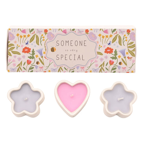Set of three decorative mini candles with cream-colored ceramic holders in flower and heart shapes, filled with pink and lavender wax, displayed with a floral patterned gift box labeled "Someone So Very Special"