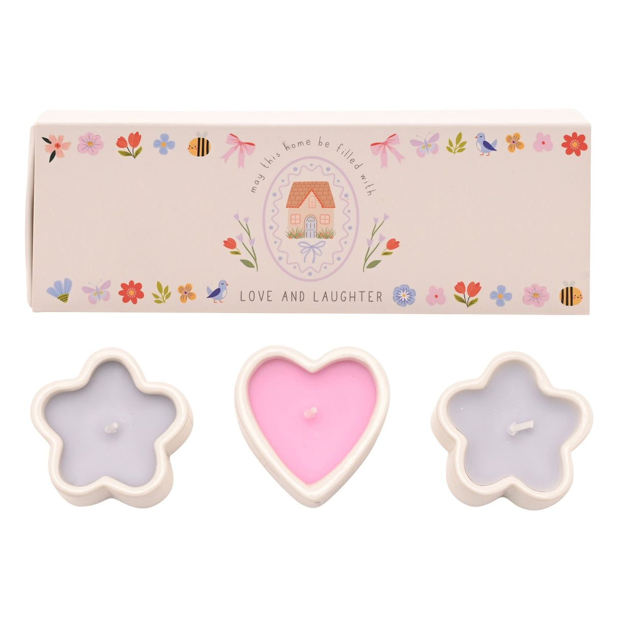 Set of three candles in star and heart shapes with a decorative box in the background.