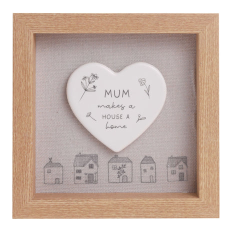 Heart-shaped ceramic plaque with 'Mum makes a house a home' text in a wooden frame.