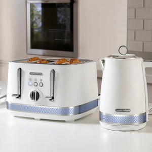 Morphy Richards Illumination white 4-slice toaster with blue dotted band detail, displaying golden toasted bread, paired with matching white electric kettle on kitchen countertop