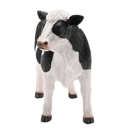 Naturecraft standing cow figurine 34cm with black and white coloring, realistic textured resin design, black hooves and pink nose on white background