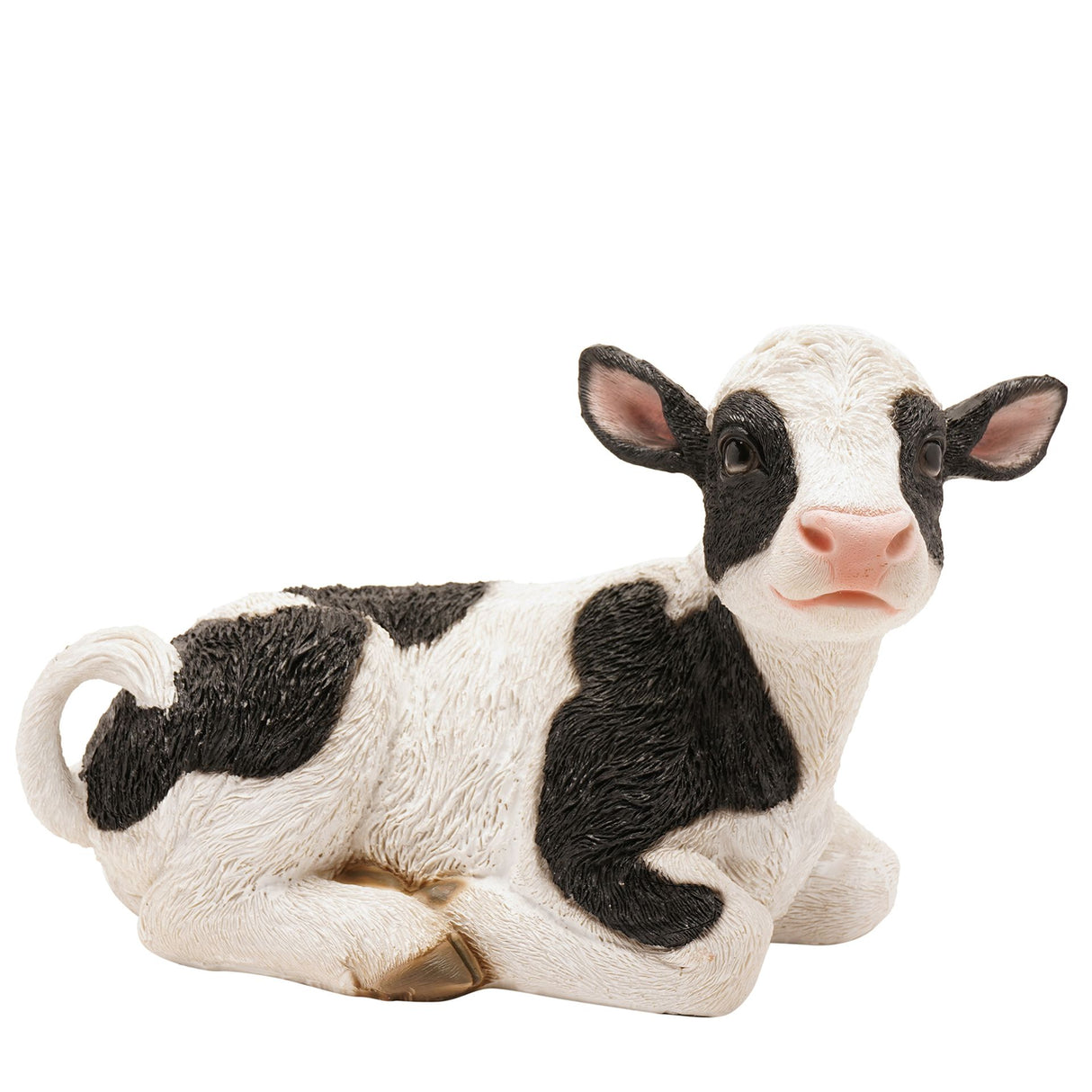 Resin figurine of a black and white cow on a white background