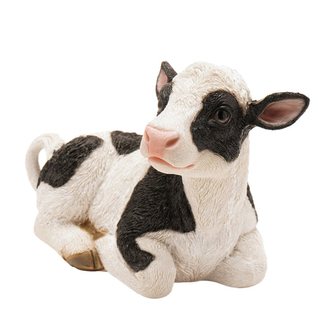 Black and white sitting cow figurine with textured resin finish, pink nose and inner ears, approximately 20.5cm tall, Naturecraft collectible animal statue