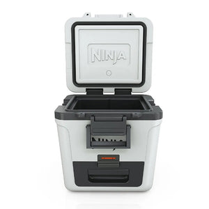 Ninja FrostVault 28 litre wheeled cooler box in cloud white and black with open lid showing grey interior storage compartments and dry zone section