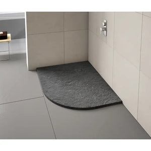 Merlyn Truestone black quadrant shower tray installed in modern bathroom with cream tile walls and grey floor