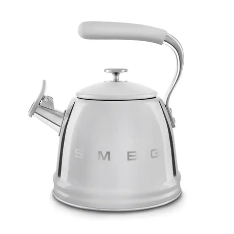 Smeg 50s Style stovetop whistling kettle in white stainless steel with chrome handle and spout, featuring embossed SMEG branding and whistle mechanism