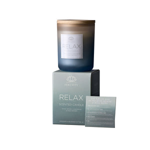 Scented candle labeled 'Relax' with packaging on a white background