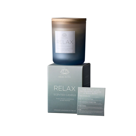 Scented candle labeled 'Relax' with packaging on a white background