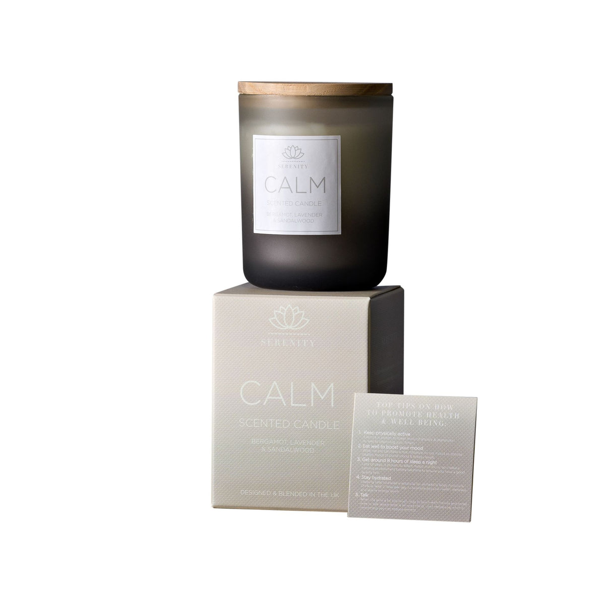 Dark glass candle with 'Calm' label on a white background