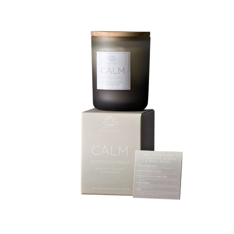 Dark glass candle with 'Calm' label on a white background