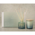 Serenity Revive diffuser and candle set on a neutral background