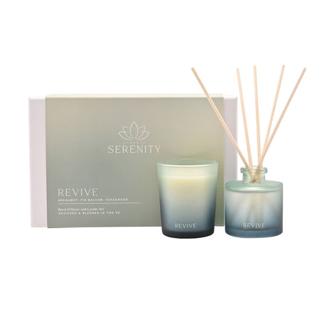 Serenity Revive luxury gift set containing a 70g scented candle and 50ml reed diffuser with bergamot, fir balsam and cedarwood fragrances in gradient glass containers with natural wooden diffuser sticks, displayed with branded packaging box