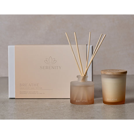 Serenity Breathe diffuser set with a candle and reeds on a neutral background