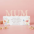Decorative sign with 'MUM' on a pink background